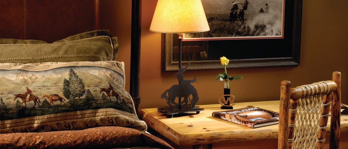 Grand Room Available with either two queen beds or one king bed. The Grand Room is particularly cozy with its overstuffed sofa and chairs, lodgepole pine furniture.